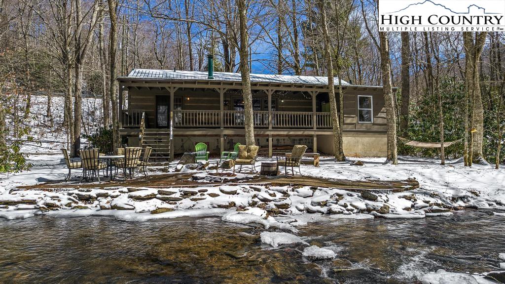 3855 Howard's Creek Road Boone, NC 28607 - Photo 6 of 38 a front view of a house with a yard