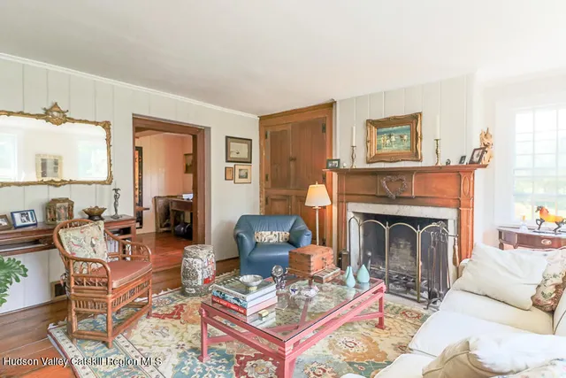 a dining room with a table and chairs