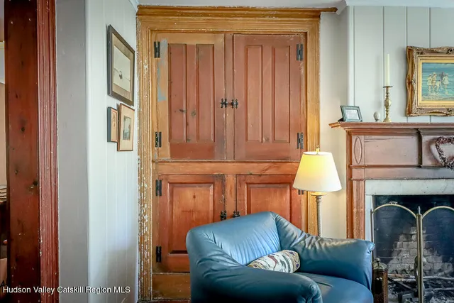 a kitchen with stainless steel appliances granite countertop a stove a sink dishwasher and a refrigerator with wooden floor