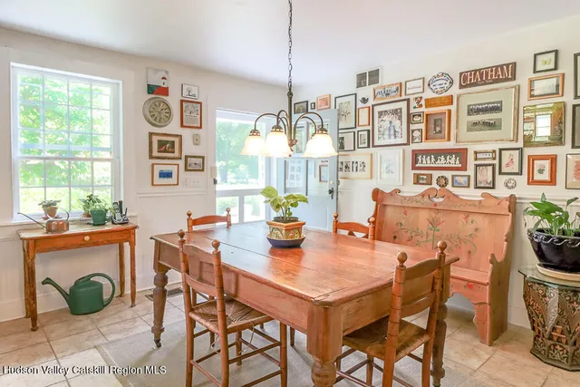 a view of a balcony with a floor to ceiling window next to a yard