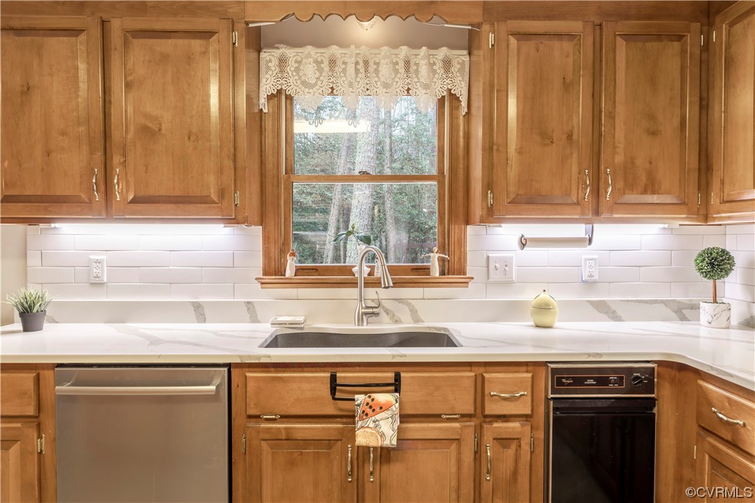 8949 Cardiff Road North Chesterfield, VA 23236 - Photo 17 of 49 a kitchen with stainless steel appliances granite countertop a sink and a window