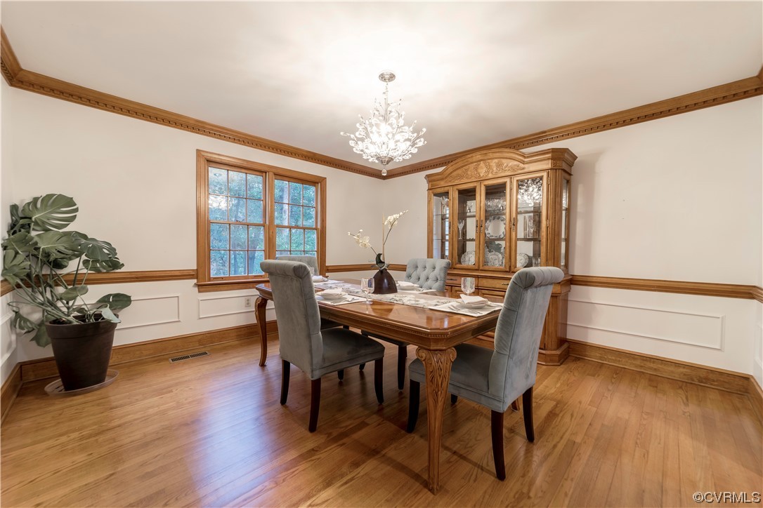 8949 Cardiff Road North Chesterfield, VA 23236 - Photo 19 of 49 a view of a dining room with furniture window and wooden floor