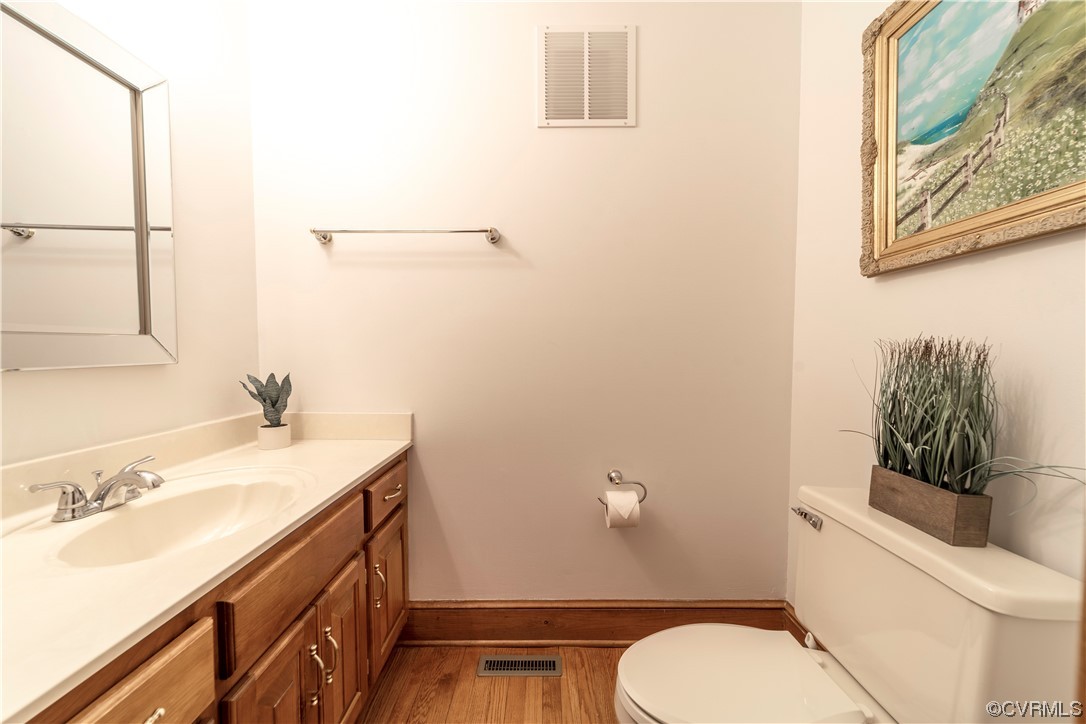 8949 Cardiff Road North Chesterfield, VA 23236 - Photo 21 of 49 a bathroom with a sink toilet and vanity