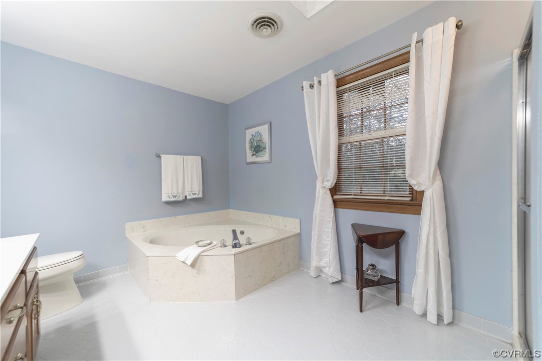 8949 Cardiff Road North Chesterfield, VA 23236 - Photo 24 of 49 a bathroom with a tub sink and toilet