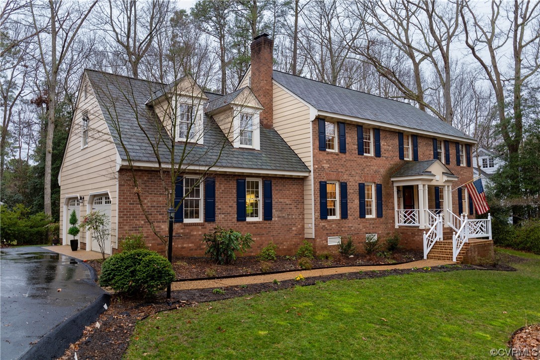 8949 Cardiff Road North Chesterfield, VA 23236 - Photo 33 of 49 a front view of a house with a yard and trees