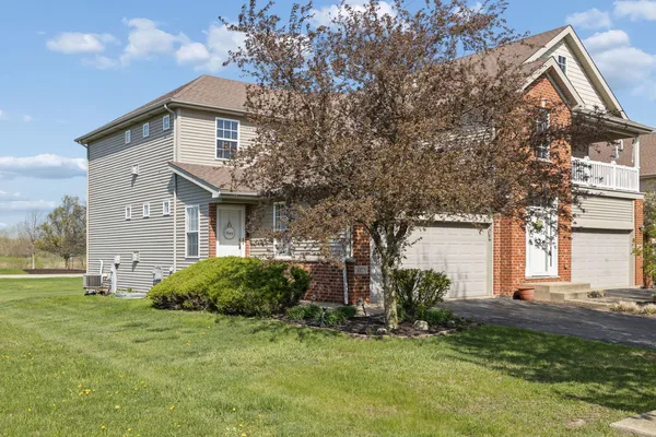 a view of a house with a yard