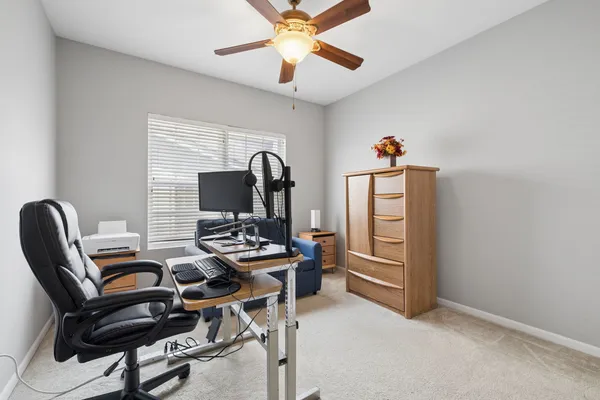 a view of a workspace with furniture