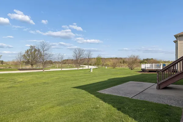 a view of a big room with an ocean and a big yard