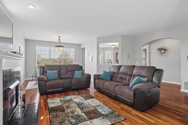 a living room with furniture and a large window