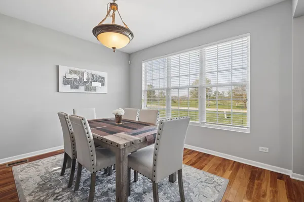 a dining room with furniture and window