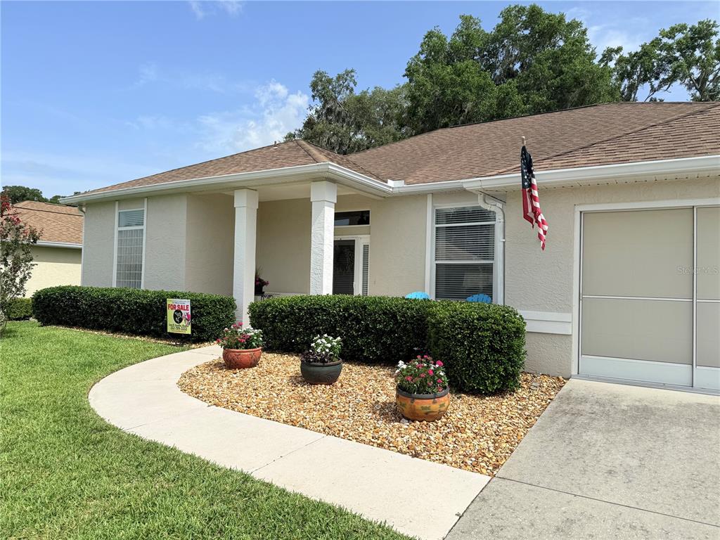 2515 Northwest 53rd Avenue Road Ocala, FL 34482 - Photo 3 of 94 a front view of a house with porch