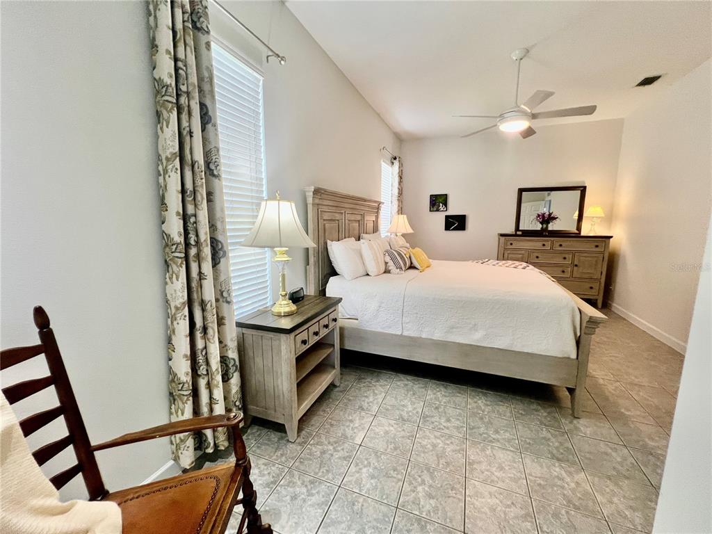 2515 Northwest 53rd Avenue Road Ocala, FL 34482 - Photo 36 of 94 a bedroom with a bed and a mirror