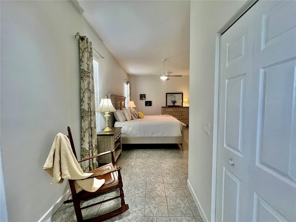 2515 Northwest 53rd Avenue Road Ocala, FL 34482 - Photo 37 of 94 a bedroom with a bed chair and the view of bathroom