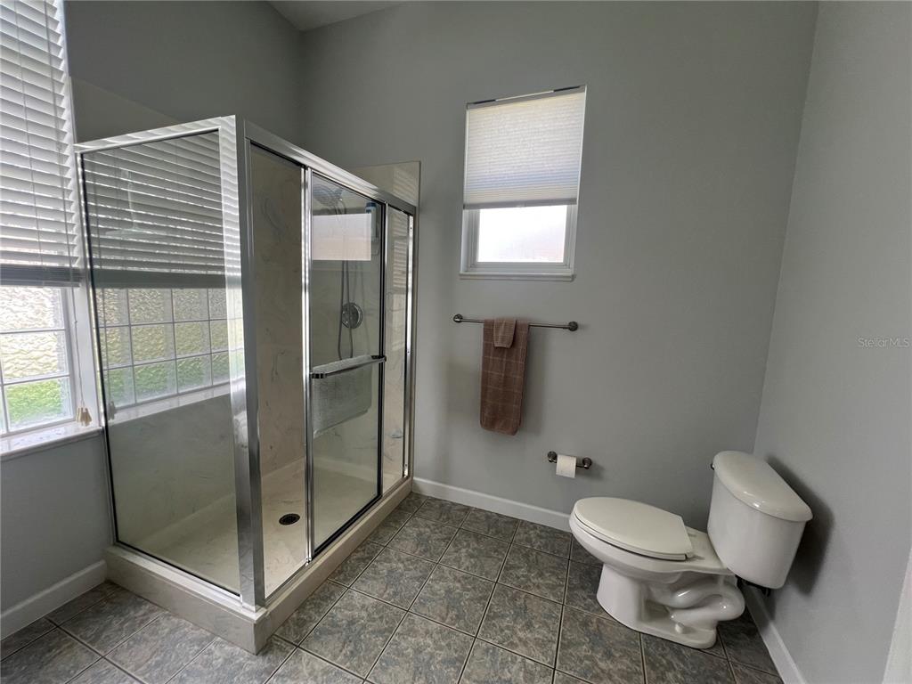 2515 Northwest 53rd Avenue Road Ocala, FL 34482 - Photo 41 of 94 a bathroom with a toilet and a shower