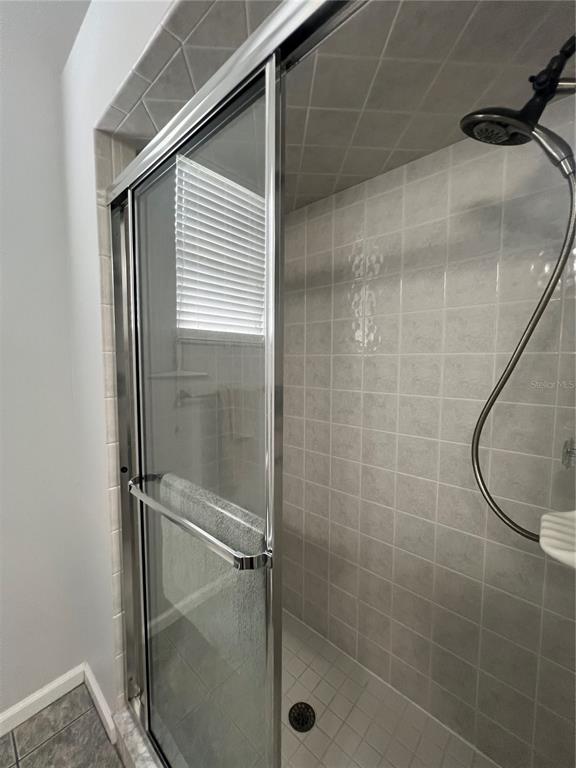 2515 Northwest 53rd Avenue Road Ocala, FL 34482 - Photo 49 of 94 a bathroom with a glass shower door