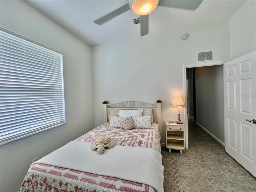 2515 Northwest 53rd Avenue Road Ocala, FL 34482 - Photo 54 of 94 a bedroom with a bed and a lamp