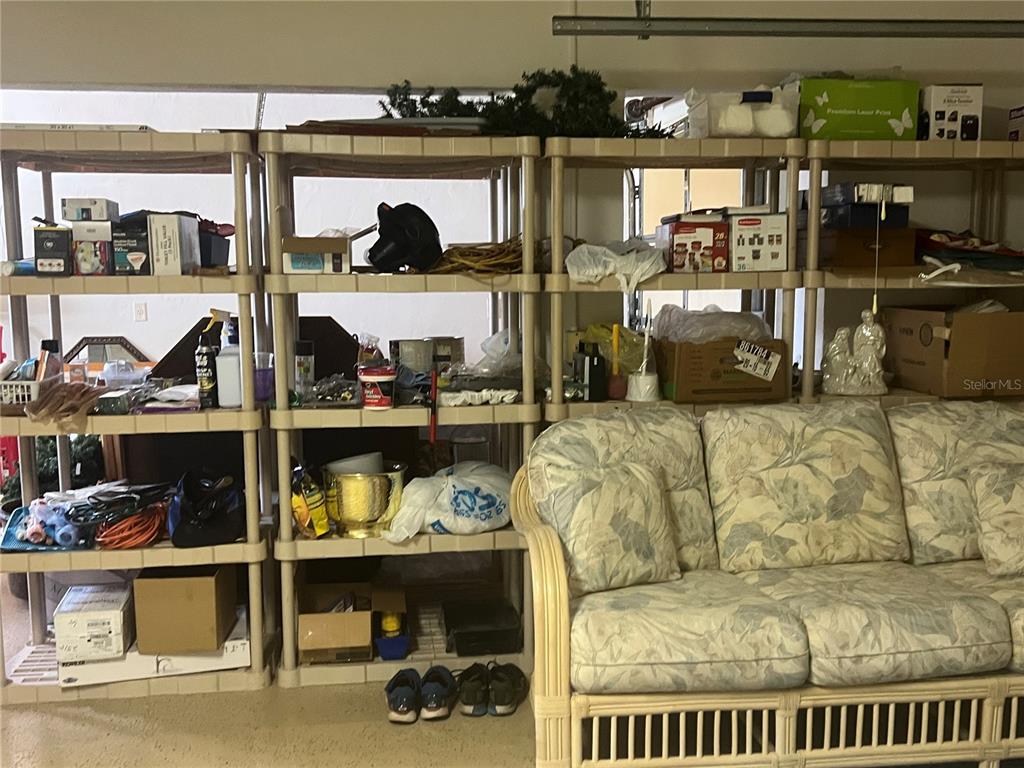 2515 Northwest 53rd Avenue Road Ocala, FL 34482 - Photo 64 of 94 a living room with lots of furniture and clutter