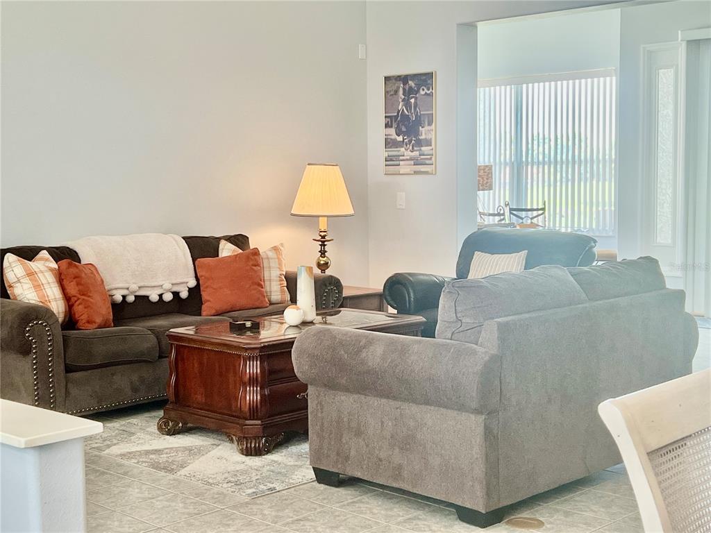 2515 Northwest 53rd Avenue Road Ocala, FL 34482 - Photo 8 of 94 a living room with furniture and a window