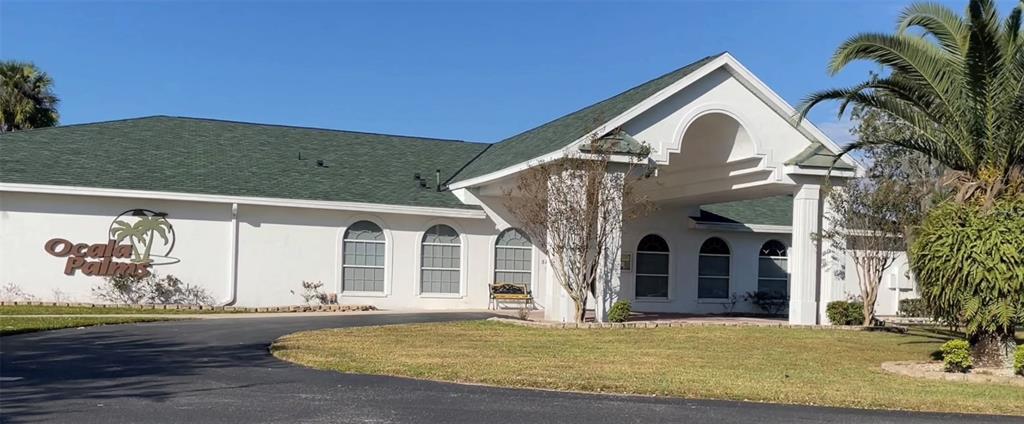 2515 Northwest 53rd Avenue Road Ocala, FL 34482 - Photo 85 of 94 a view of a white house with a yard and potted plants