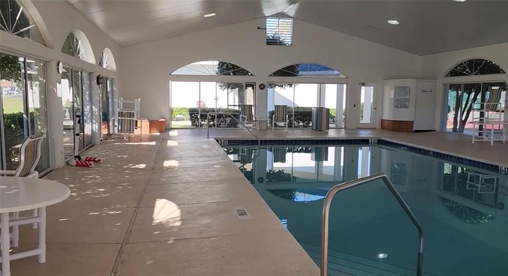 2515 Northwest 53rd Avenue Road Ocala, FL 34482 - Photo 89 of 94 a view of a living room and chandelier with furniture