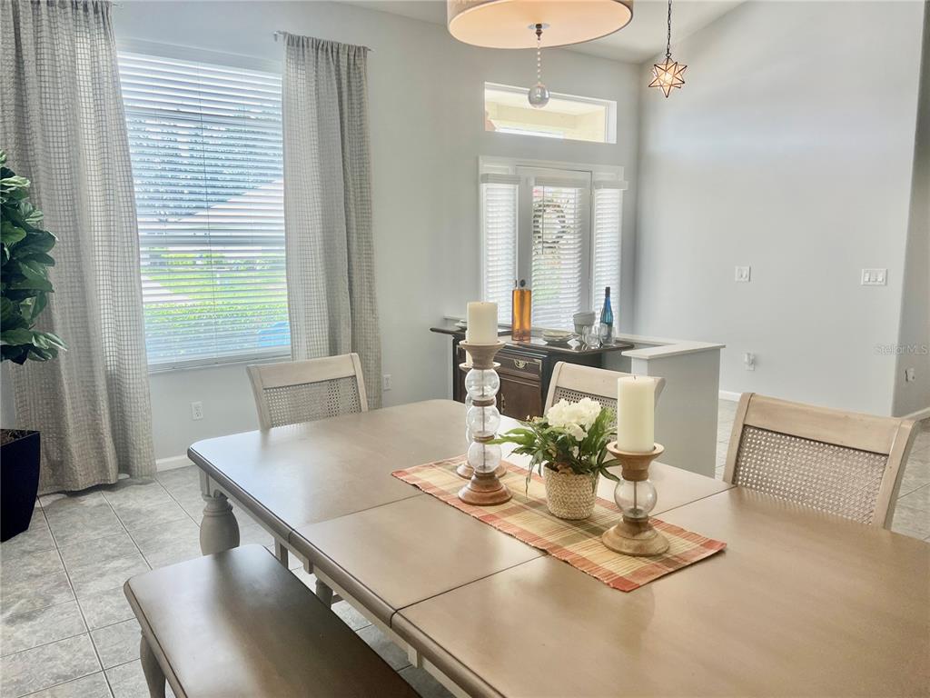 2515 Northwest 53rd Avenue Road Ocala, FL 34482 - Photo 9 of 94 a dining room with furniture and window