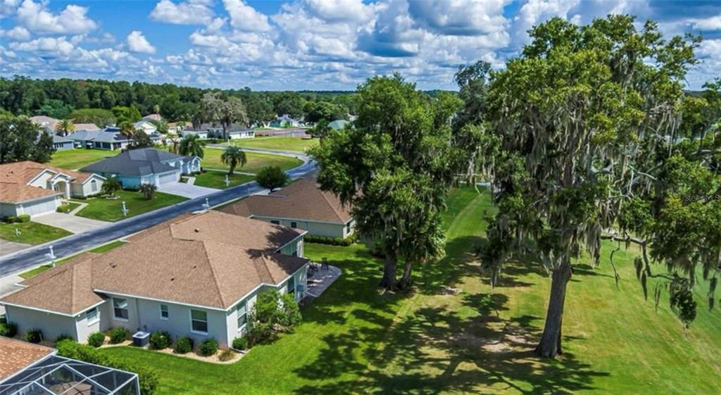 2515 Northwest 53rd Avenue Road Ocala, FL 34482 - Photo 93 of 94 an aerial view of a house with a yard basket ball court and outdoor seating