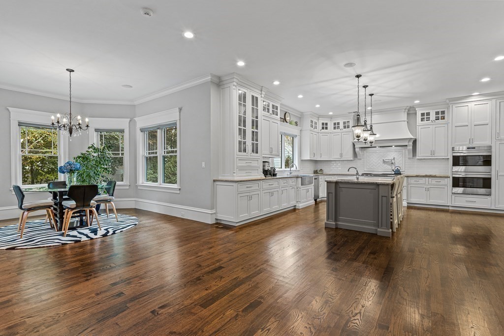 3 Ravine Road Winchester, MA 01890 - Photo 19 of 42 a large open kitchen with a table and chairs