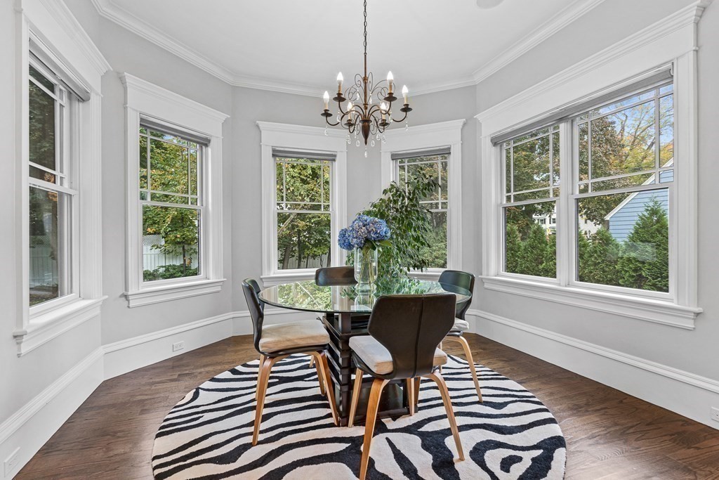 3 Ravine Road Winchester, MA 01890 - Photo 21 of 42 a view of a dining room with furniture a chandelier and wooden floor