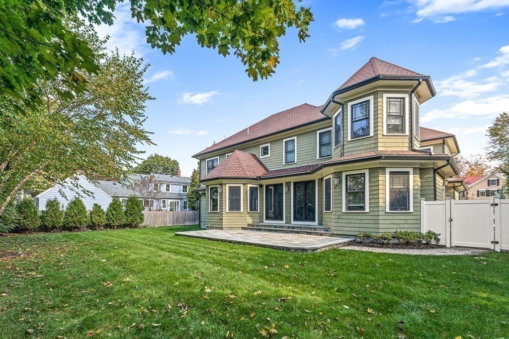 3 Ravine Road Winchester, MA 01890 - Photo 3 of 42 a front view of a house with a yard and trees