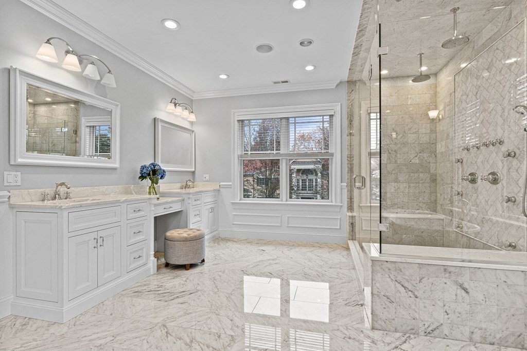 3 Ravine Road Winchester, MA 01890 - Photo 31 of 42 a spacious bathroom with a shower sink and mirror