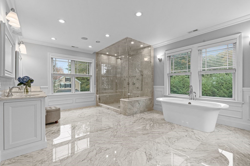 3 Ravine Road Winchester, MA 01890 - Photo 32 of 42 a bathroom with a large tub a vanity and a shower