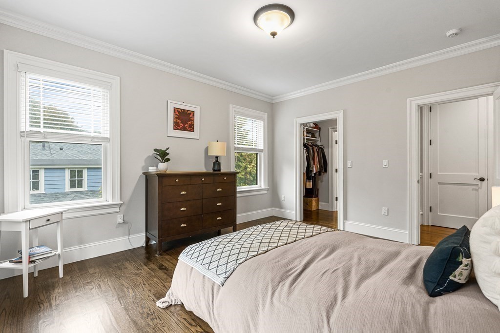 3 Ravine Road Winchester, MA 01890 - Photo 36 of 42 a bedroom with a bed and wooden floor