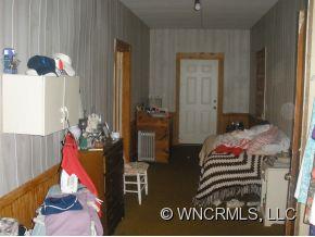 187 Southern Street Rutherfordton, NC 28139 - Photo 8 of 9 a bedroom with a bed and a dresser
