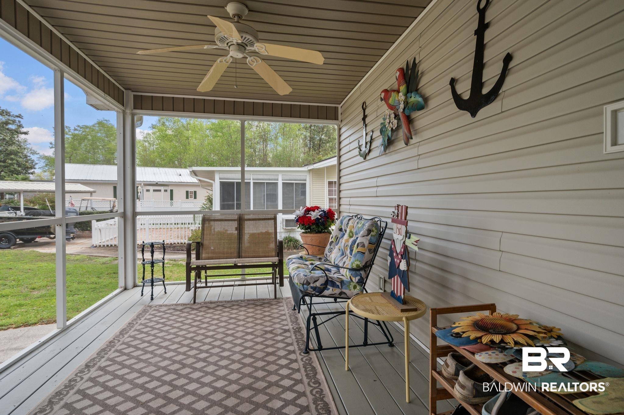 24711 County Road 20, Unit A11 Elberta, AL 36530 - Photo 21 of 35 Sunroom / solarium with ceiling fan and a wooden deck