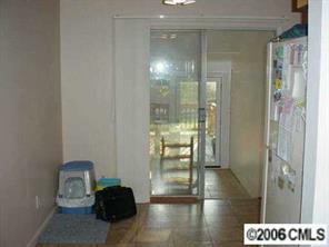 4100 Woodleaf Road Charlotte, NC 28205 - Photo 4 of 8 a view of a glass door and a glass door