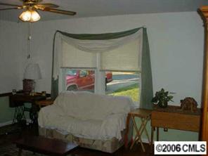 4100 Woodleaf Road Charlotte, NC 28205 - Photo 7 of 8 a bed room with a bed and a potted plant