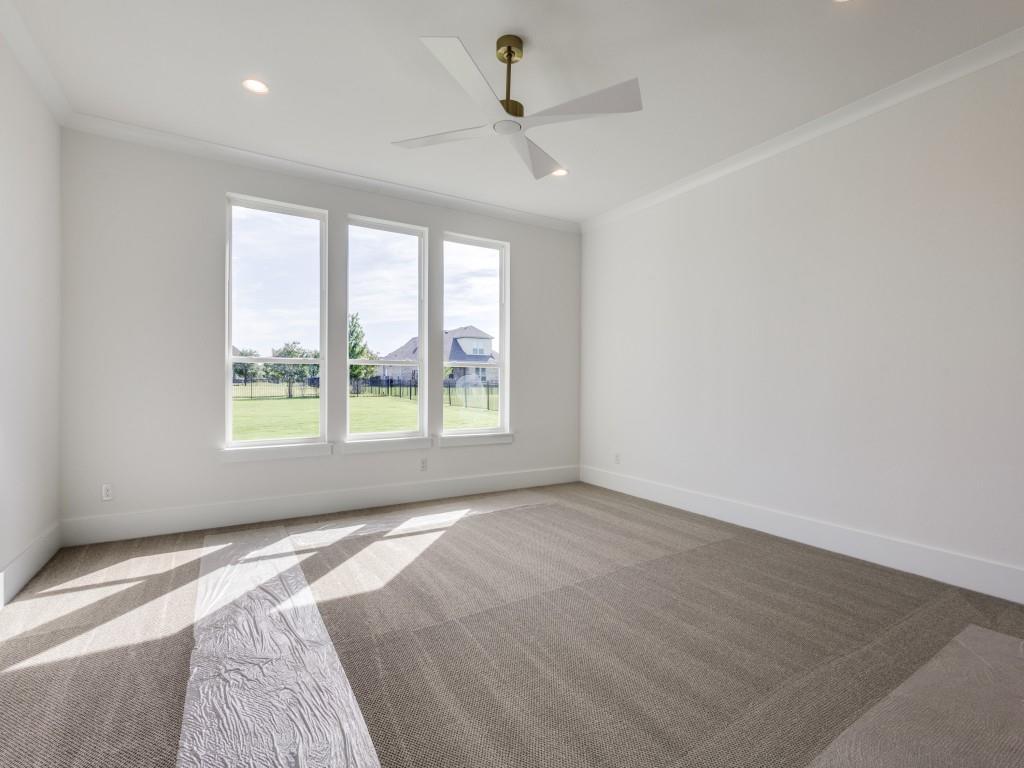 1045 Bent Tree Lane Gunter, TX 75058 - Photo 15 of 25 a view of a livingroom with a ceiling fan and window