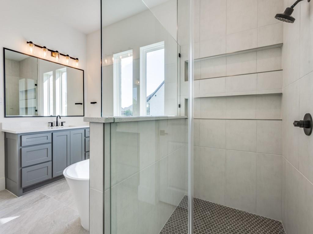 1045 Bent Tree Lane Gunter, TX 75058 - Photo 19 of 25 a bathroom with a sink a toilet and shower