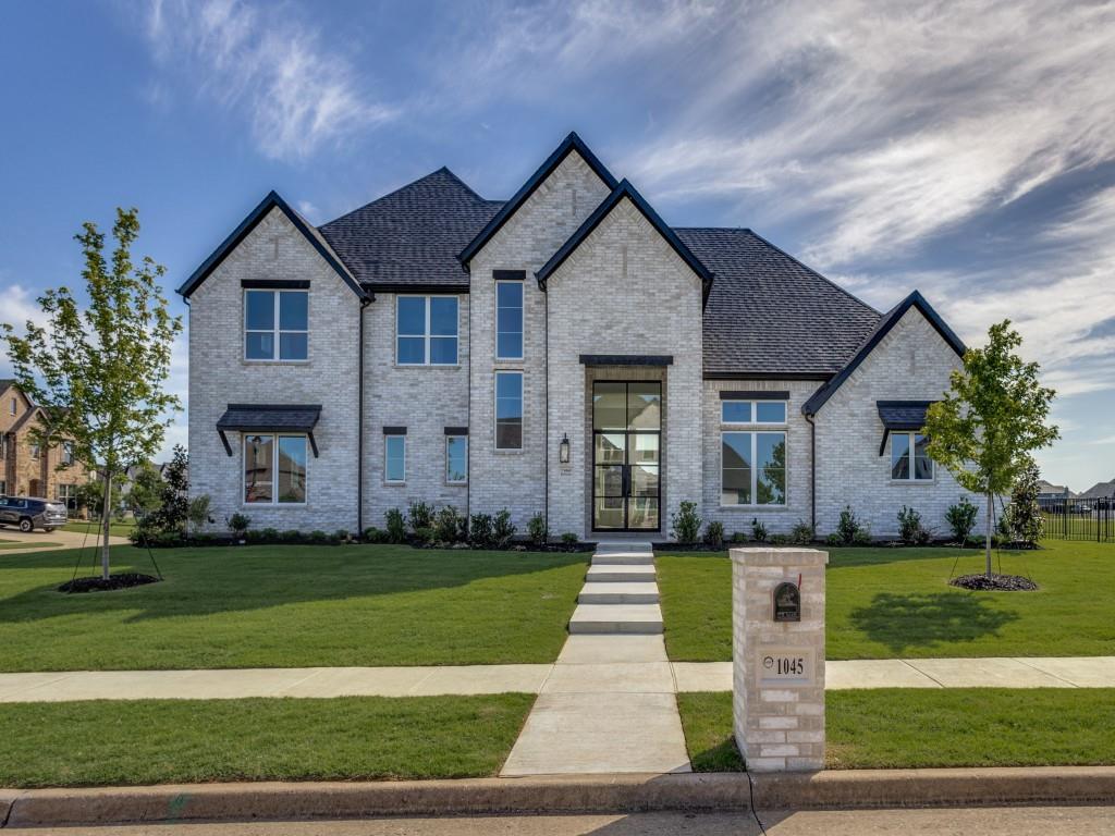 1045 Bent Tree Lane Gunter, TX 75058 - Photo 2 of 25 a front view of a house with a yard
