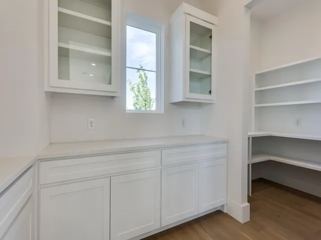 a view of cabinets and window