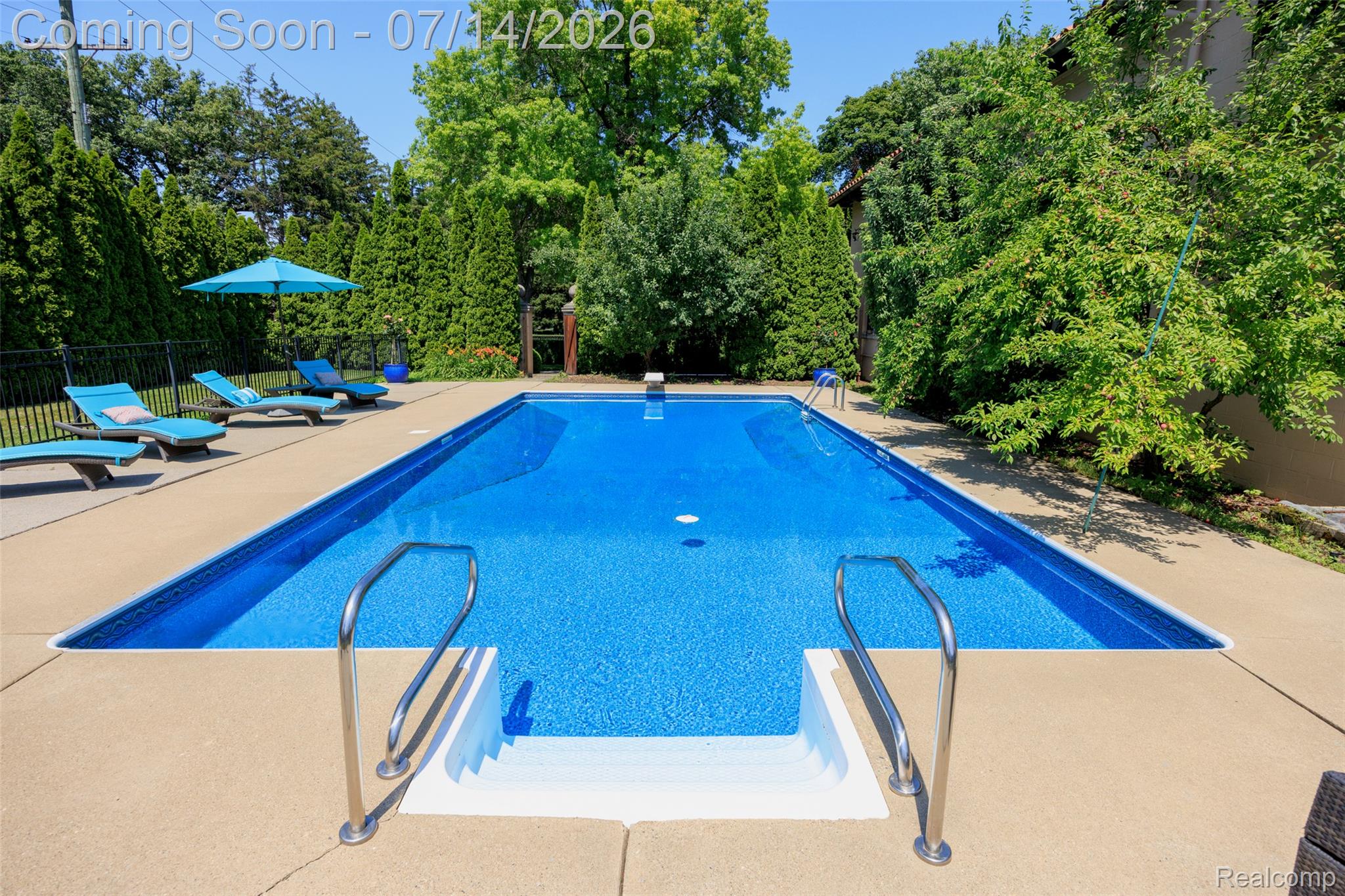 189 Cloverly Road Grosse Pointe, MI 48236 - Photo 80 of 96 Rectangular inground pool featuring a blue patterned liner and broad concrete decking