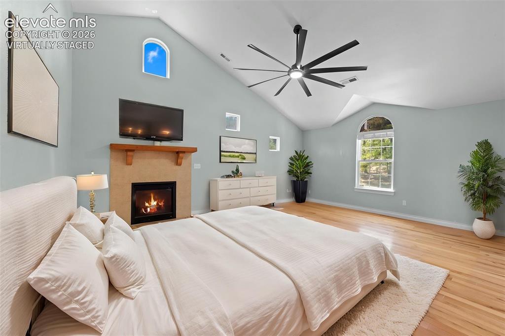 16540 Mesquite Road Peyton, CO 80831 - Photo 27 of 50 a spacious bedroom with a bed and a flat screen tv