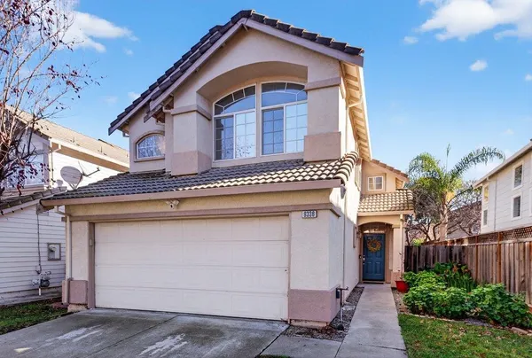 a front view of a house with a garage