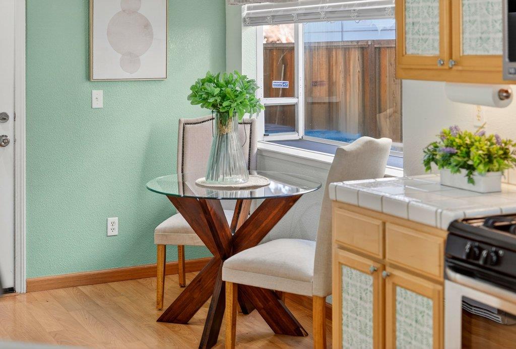 9336 Lariat Drive Gilroy, CA 95020 - Photo 12 of 41 a view of a dining room with furniture and a potted plant