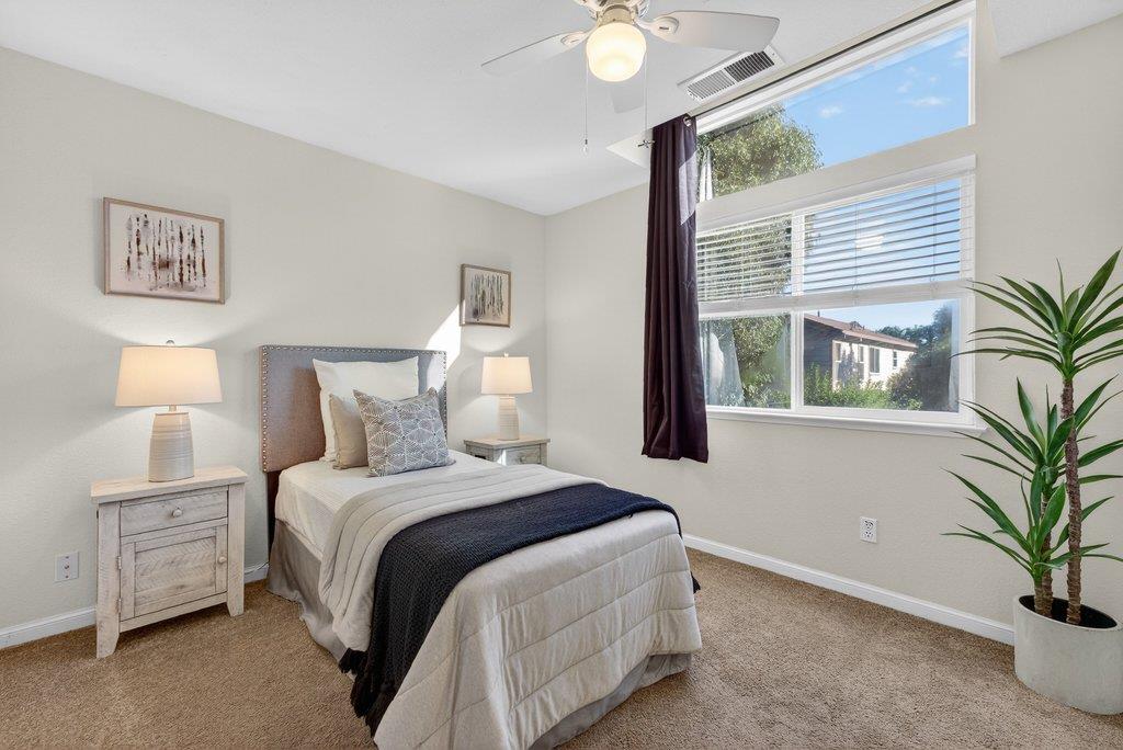 9336 Lariat Drive Gilroy, CA 95020 - Photo 29 of 41 a bedroom with a bed and a potted plant
