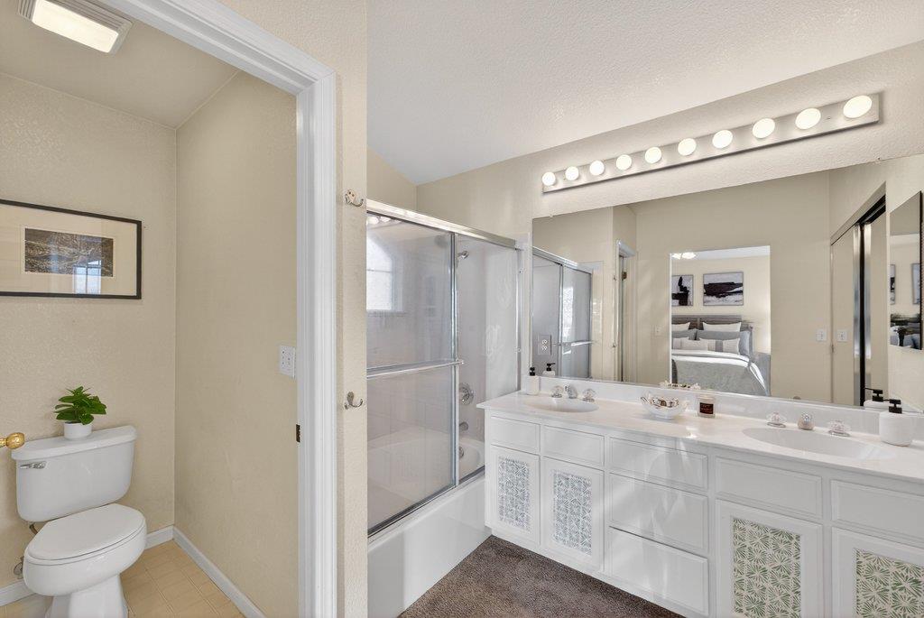 9336 Lariat Drive Gilroy, CA 95020 - Photo 32 of 41 a bathroom with a double vanity sink mirror and toilet