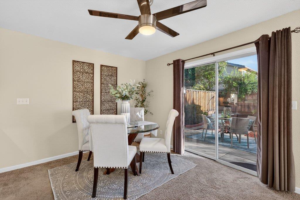 9336 Lariat Drive Gilroy, CA 95020 - Photo 39 of 41 a dining room with furniture a chandelier and a rug