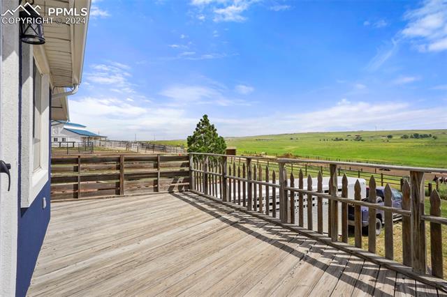 8155 Soap Weed Road Calhan, CO 80808 - Photo 38 of 39 Wooden terrace with a rural view