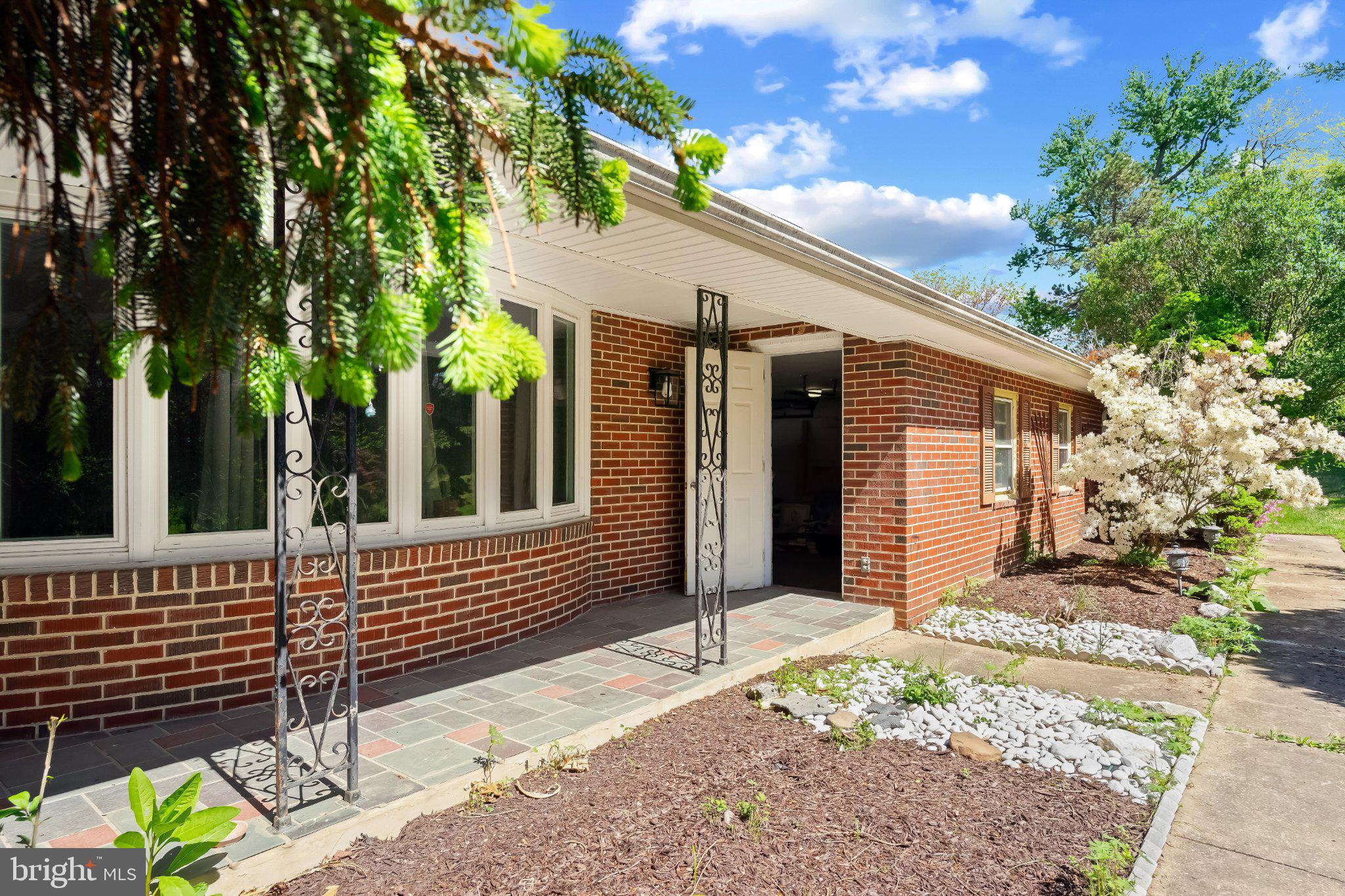 5422 Woodbine Road Woodbine, MD 21797 - Photo 5 of 39 Charming brick entryway with greenery.