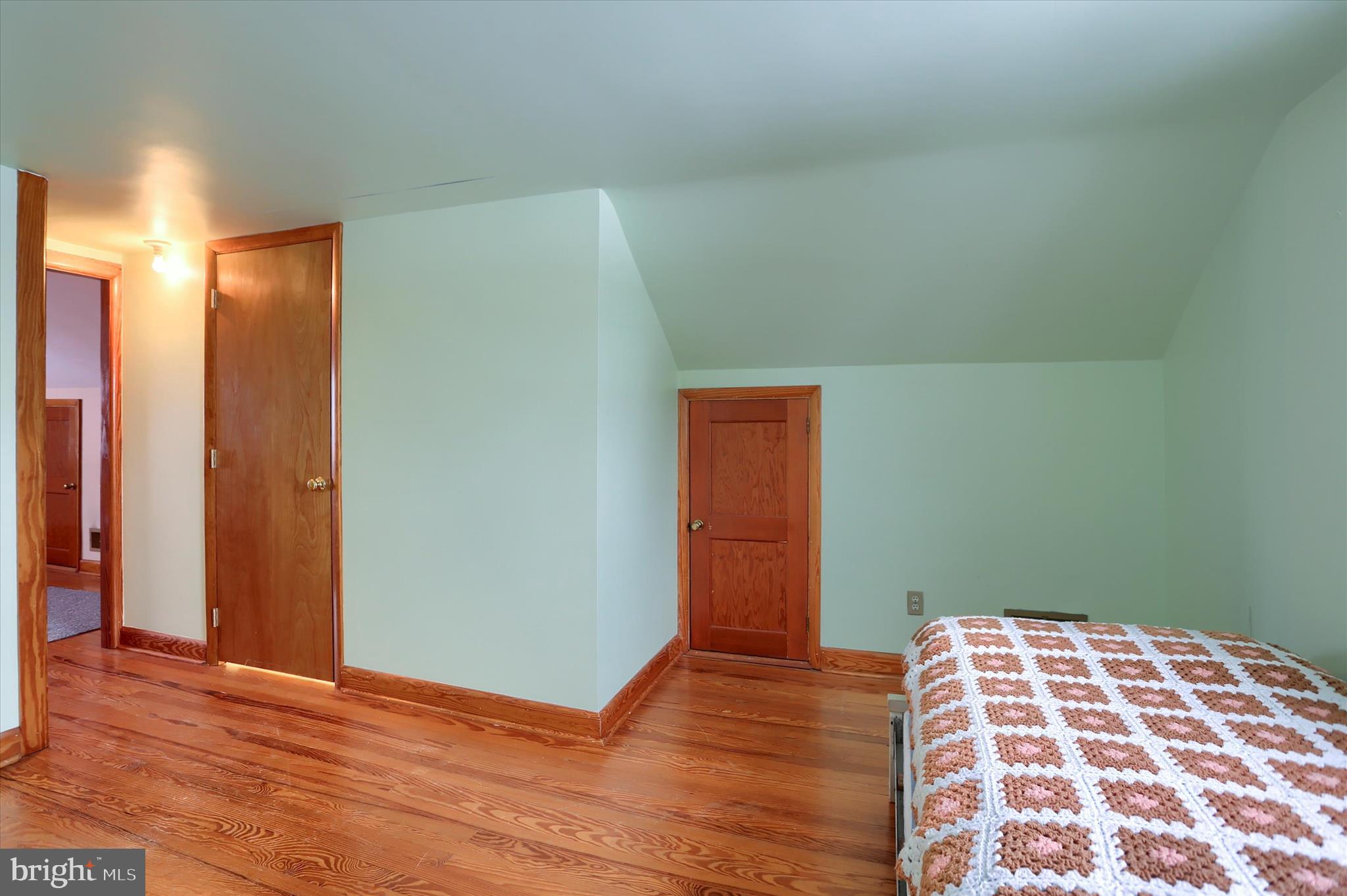 678 Littlestown Road Littlestown, PA 17340 - Photo 21 of 53 an empty room with wooden floor and pillows